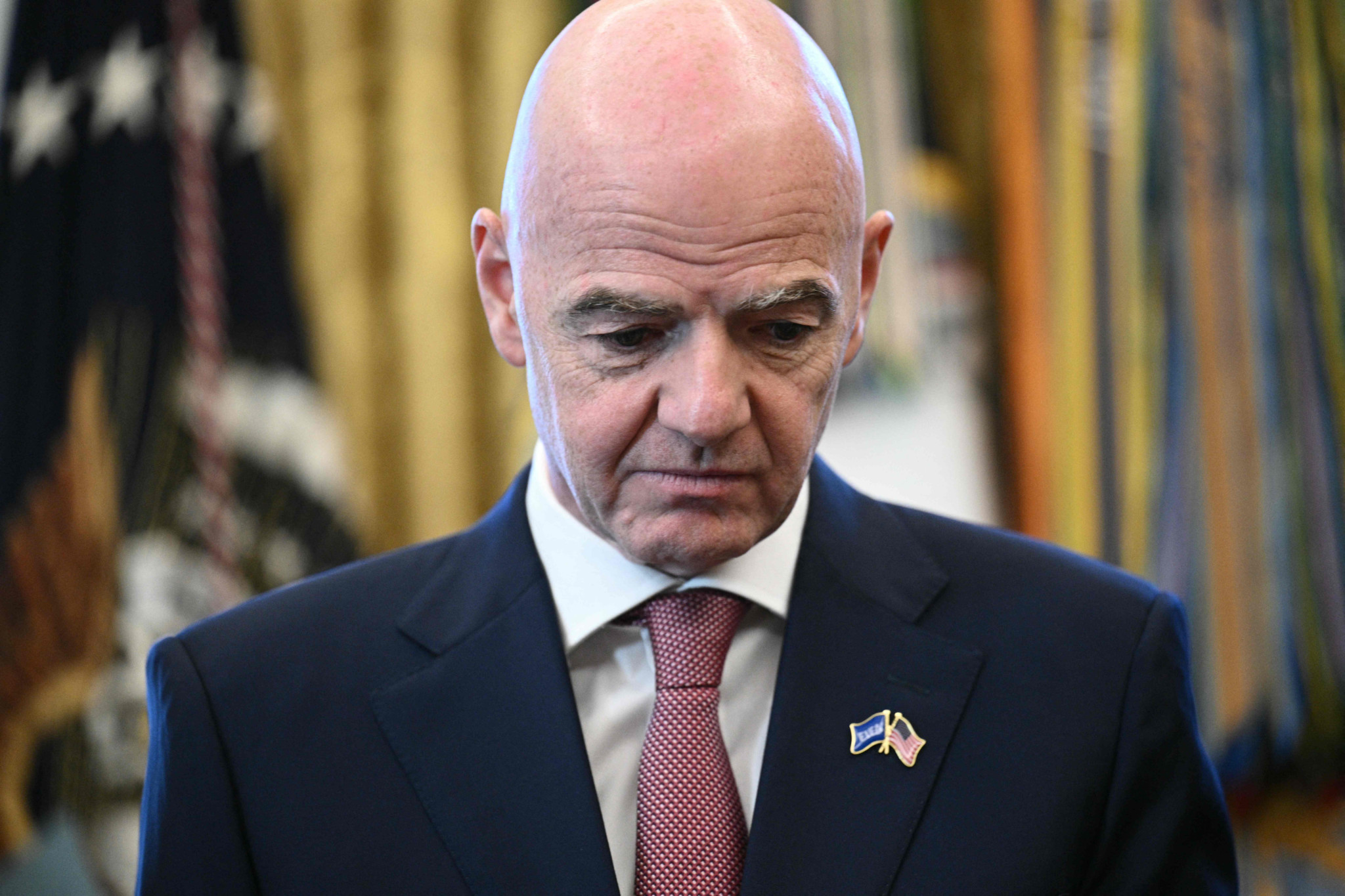 (FILES) FIFA president Gianni Infantino looks on during a meeting with the White House Task Force on the FIFA World Cup 2026 in the Oval Office of the White House in Washington, DC on November 17, 2025. FIFA president Gianni Infantino has lost the "confidence" of the UEFA, European football's governing body, it said in a statement on August 1, 2026, after his plan to allow private investment in the World Cup was withdrawn following a global backlash. (Photo by Brendan SMIALOWSKI / AFP)
